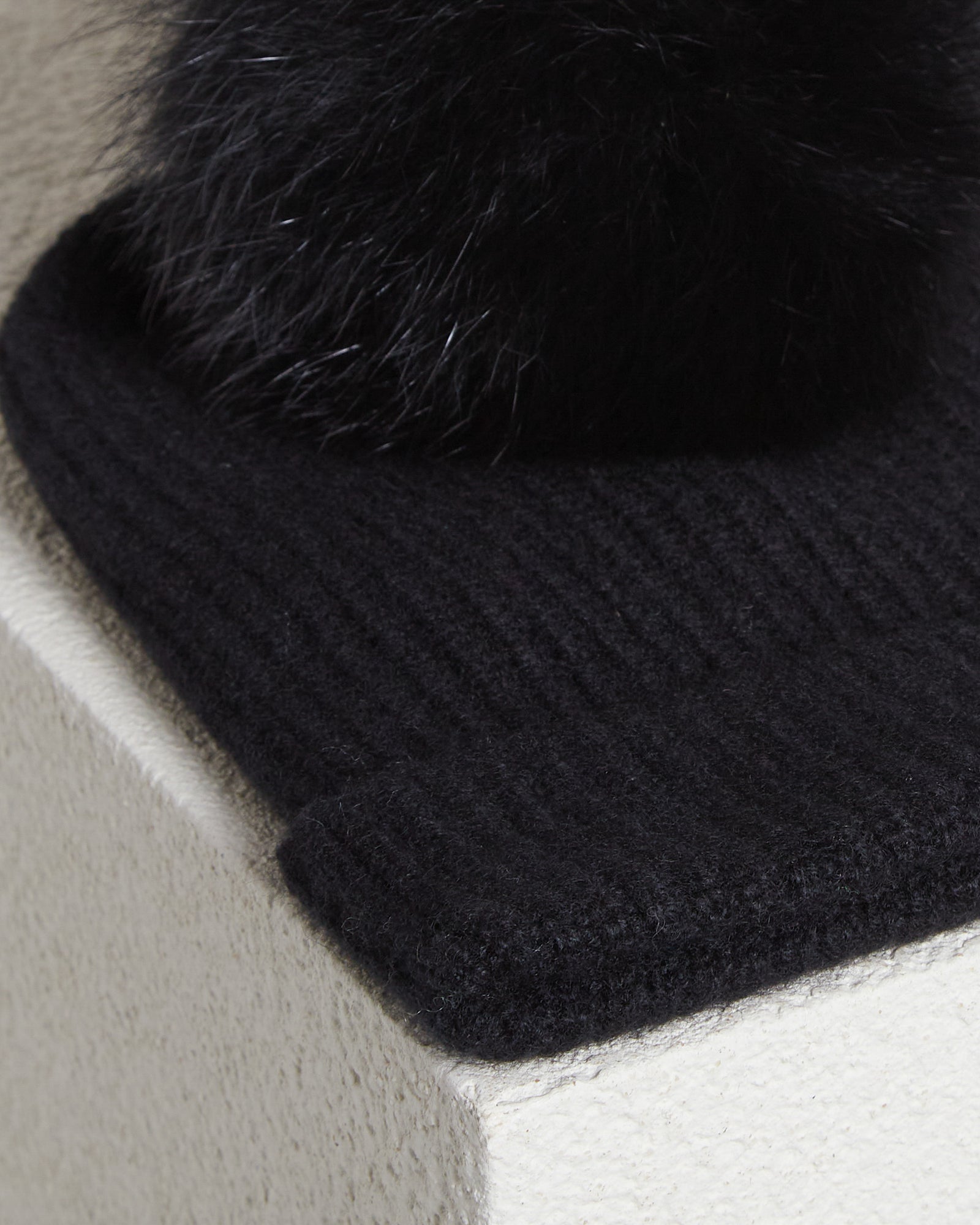 Black knitted cap with pom-pom in Kid Cashmere